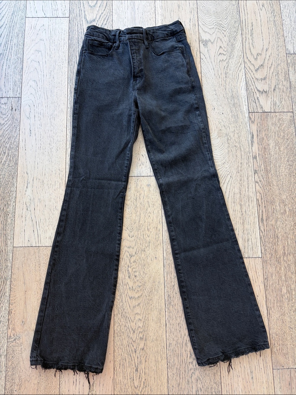 Good American Black Flare Jeans with Raw Hem